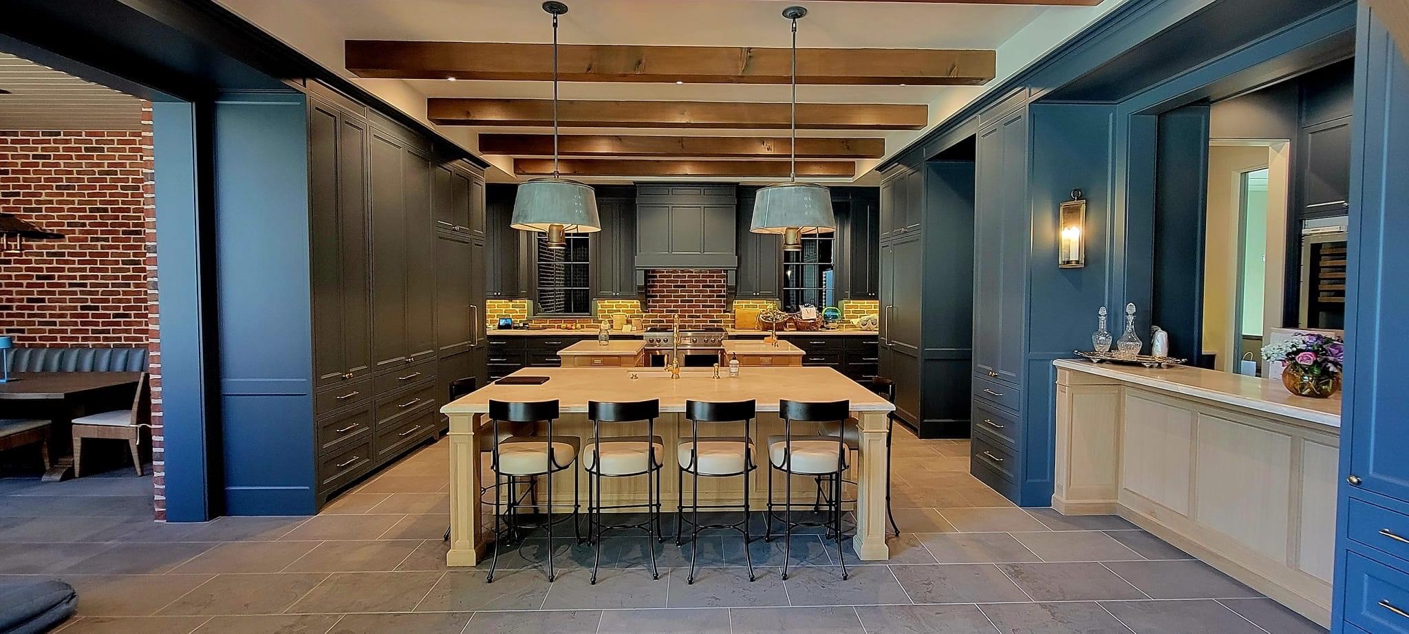 Commercial Cabinets navy and clear wood Sleek black kitchen featuring brown seating stools, stainless appliances, glossy cabinets, and minimalist contemporary design.