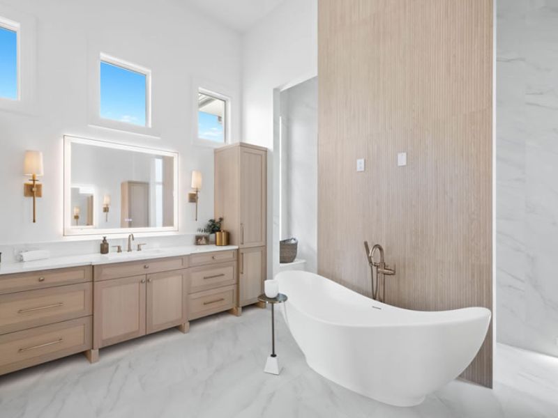 Modern Bathroom with White Cabinets and Light Brown Accents