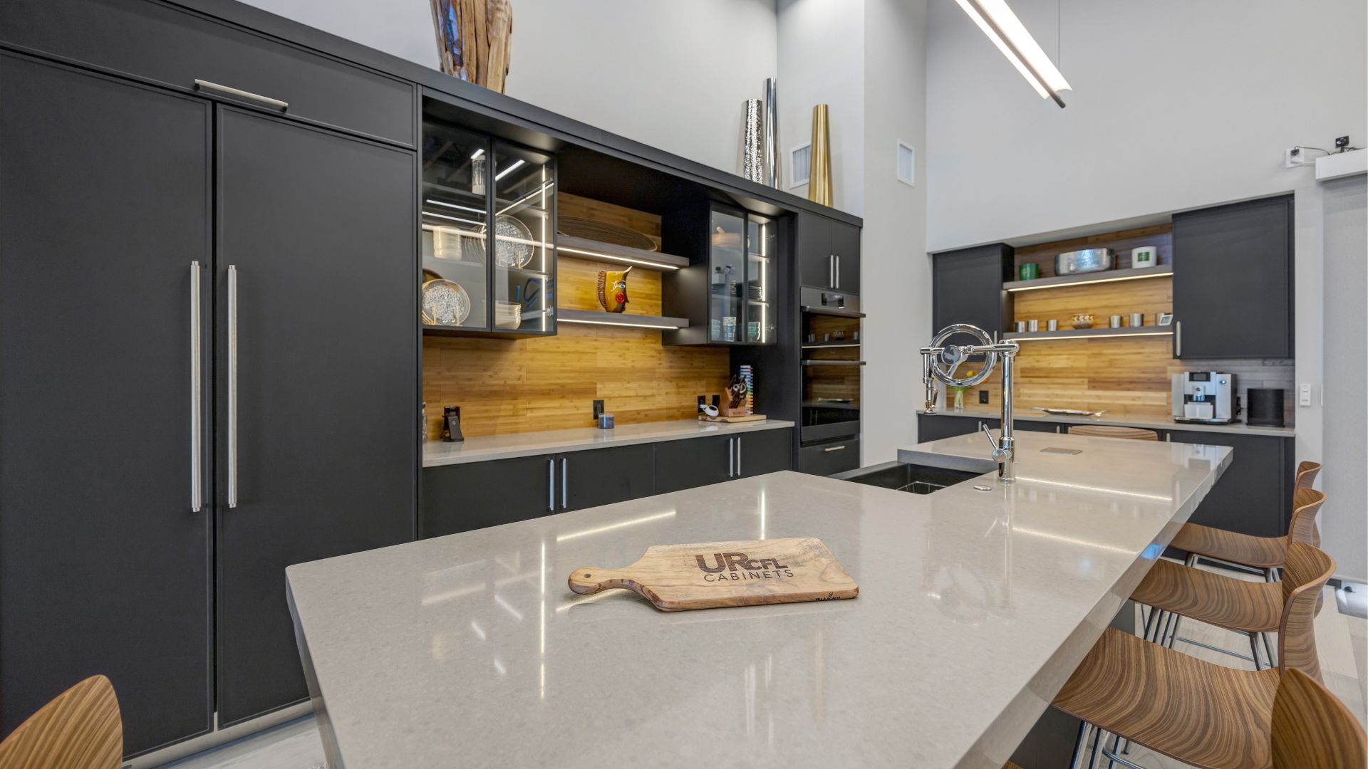 Sleek Modern Black Kitchen Minimalist white kitchen with all-white cabinetry and a bold white island, contrasted by matte black lower accents, hardware, and fixtures to create a striking modern aesthetic.